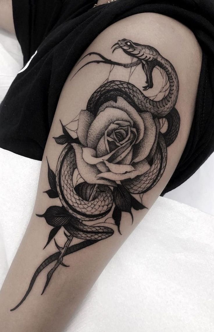 Snake and Rose Tattoo Ideas and meaning: The Beautiful Paradox of Danger and Beauty