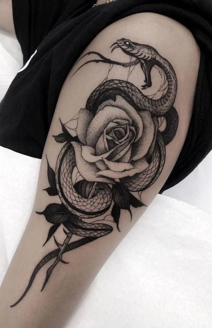 Snake and Rose Tattoo Ideas and meaning: The Beautiful Paradox of Danger and Beauty
